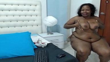 Slutty Colombian webcam hoe munches on her own panties during pee show.