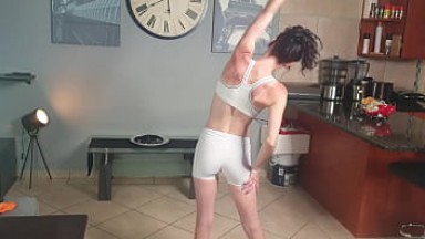 Skinny girl pissing on her own face and in her mouth through white pants