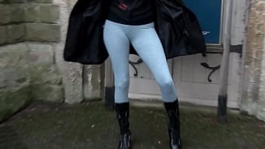 Horny girl pisses in leggings and shows her tits in public