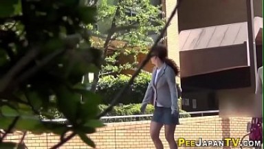 Humiliated asian pisses herself outdoors
